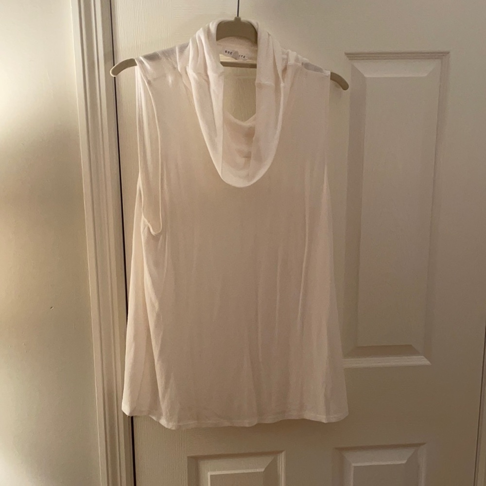 White sleeveless turtleneck